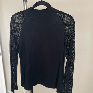 Sweater with lacy sleeves, rayon/poly. Nice with slacks or skirts.